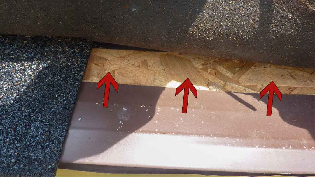 lifted roof shingle showing lack of ice guard