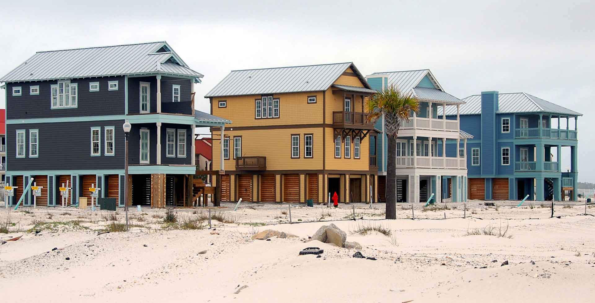 Multiple beach houses all with metal roofs